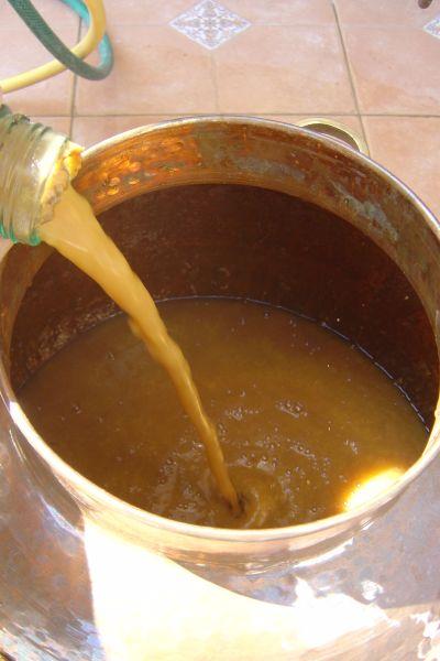 apricot mash in a still caldron